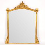 An arch-top gilded overmantel mirror with moulded border,