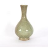 A late Ming celadon glaze bottle vase, incised decoration, 26.