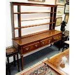 An 18th Century oak and crossbanded dresser with shelves over and fitted three drawers to the base,