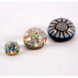 A millefiori glass paperweight,