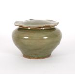 A Ming celadon glaze circular pot and cover, 12.