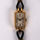 A Jaeger-LeCoultre 18k gold cased wristwatch, the rectangular dial with Arabic numerals in gilt,