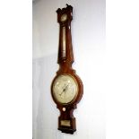 A 19th Century mahogany cased wheel barometer, with dry/damp dial above a thermometer (broken),