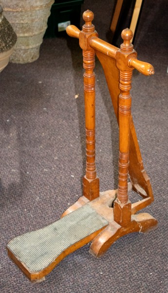 An oak boot jack by Tom Hill, with ivorine trade label 'Tom Hill, London SW1, (Knightsbridge) Ltd',