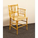 A late Regency simulated bamboo armchair with rush seat and spindle back