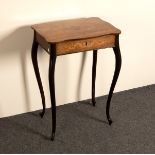 A 19th Century rosewood table of serpentine outline, fitted nine compartments on cabriole legs,