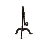 An 18th Century wrought iron rush-light holder with scroll termination to the twist handle,