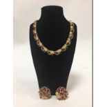 Trifari, a necklace and matching earrings,