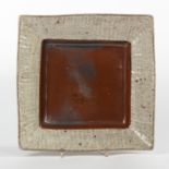 Shimaoka Tatsuzo (Japanese 1917-2007), a square stoneware dish, the centre with mottled brown glaze,