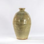 Mike Dodd (British, born 1943), a large stoneware bottle vase in hakeme glaze incised wheat,