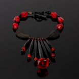 Eleyne Williams, a black and red beaded drop necklace,