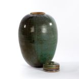 John Calver (British, born 1947), an ovoid vase in mottled glaze of purple, blue and green shades,