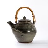 David Leach (British 1911-2005) for Lowerdown Pottery, a speckled ash glaze teapot with cane handle,