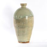 Mike Dodd (British, born 1943), a large celadon glaze vase with wheat ear motifs,