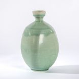 Style of Edmund de Waal, a square shouldered bottle vase with graduated celadon glaze,