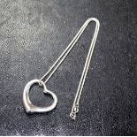 Elsa Peretti (Italian, born 1940) for Tiffany, a silver open heart pendant on Brazilian link chain,