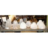 A quantity of glass light shades, including opaque and fluted,