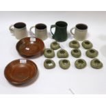 Micki Schloessingk, a green glaze mug with scroll handle, 12cm high,