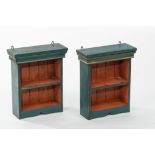 A pair of green painted hanging shelves,