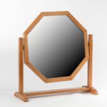 Heals, an octagonal oak dressing table mirror, on a swing-frame base with inset ivorine Heals label,