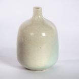 Derek Davis (British 1926-2008), a porcelain bottle vase with narrow neck in thin white glaze,