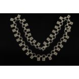 A Finnish silver necklace, the square links each with quatrefoil below,