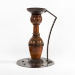 A Jugendstil copper and wood candlestick by Goberg,