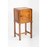 Gordon Russell, a walnut bedside cupboard of square form with burr inset panel to each side,