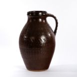 Gwyn Hanssen Pigott (Australian 1935-2013), a textured pitcher in chestnut glaze, circa 1960,