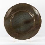 Ray Finch for Winchcombe Pottery, a 1970s large circular plate, speckled glaze in green,