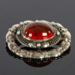 George Jensen, a Danish silver and amber brooch, no.