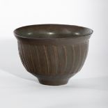 David Leach (British 1911-2005), a tenmoku glaze fluted bowl, impressed marks,