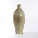 Paul Barron (British 1917-1983), a tall bottle vase of ribbed design with cream glaze, seal mark,