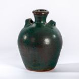 Trevor Corser (British 1938-2015) for Leach Pottery, a green vase of amphora form,