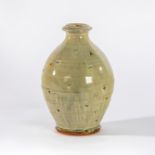 Mike Dodd (British, born 1943), a celadon glaze bottle vase with triangular cut patterns, seal mark,