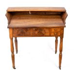 A walnut 19th Century washstand with galleried top,