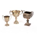 Three small silver trophy cups,