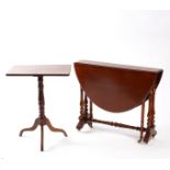 A Victorian walnut Sutherland table with oval two-flap top, 87cm wide and a Victorian tripod table,