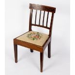 An Edwardian mahogany rail back single chair with inlaid cresting rail, fitted a loose trap seat,