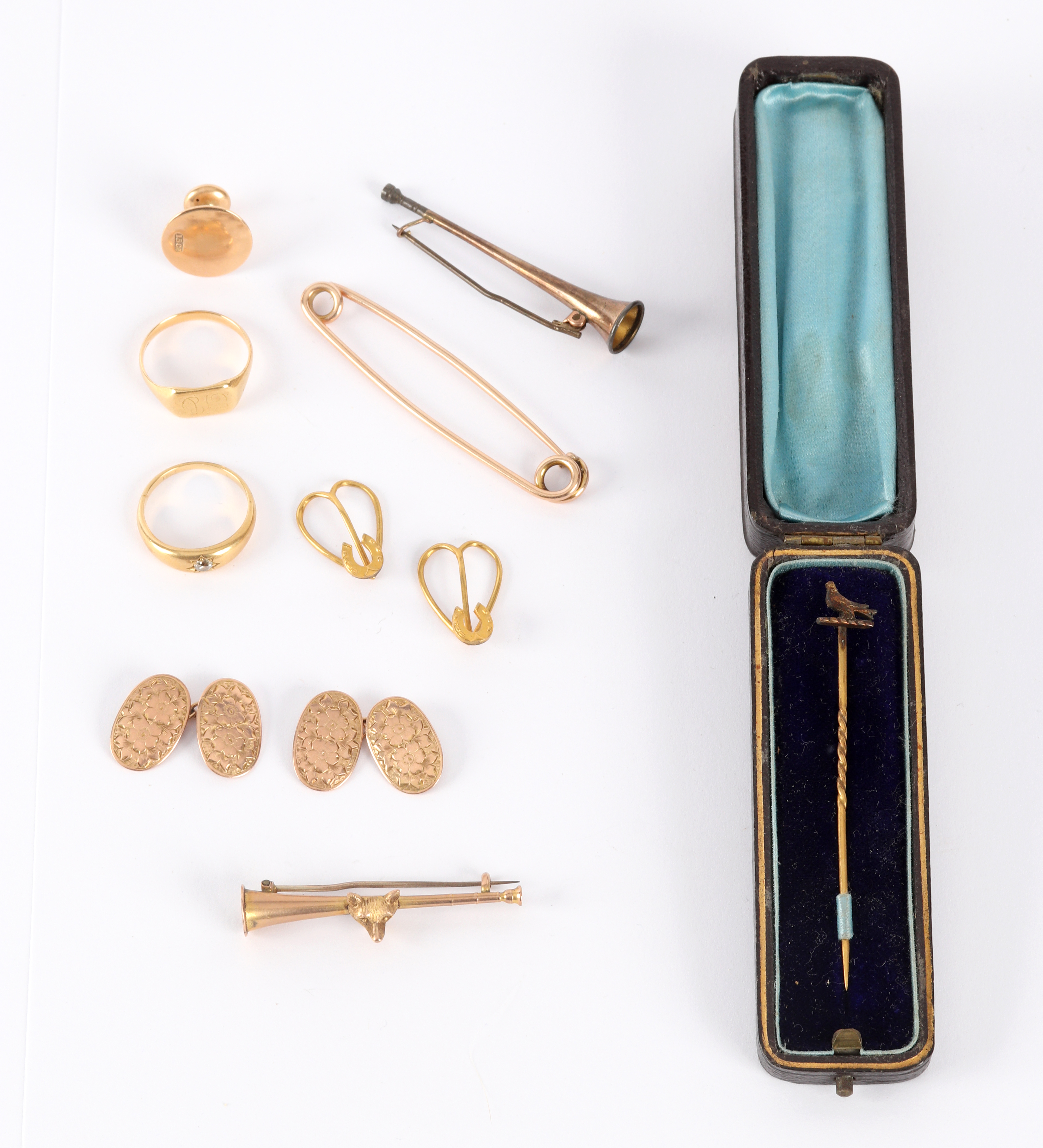 A quantity of gold stick pins, rings etc.