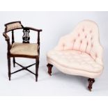 A button upholstered corner armchair on turned front legs,