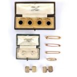 A set of four onyx dress buttons, set in 9ct gold and platinum, cased by RJ Emerson Ltd,