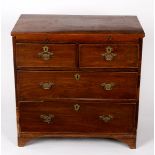 A late 18th Century elm and mahogany chest of two long over two short drawers,