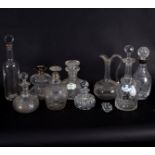 A group of nine glass decanters,