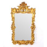 A George III carved and gilded wall mirror, circa 1760,