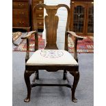 A George I fruitwood armchair, with shaped upright splat,