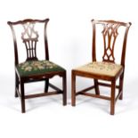 Two 18th Century mahogany single chairs with pierced upright splat backs, fitted loose trap seats,