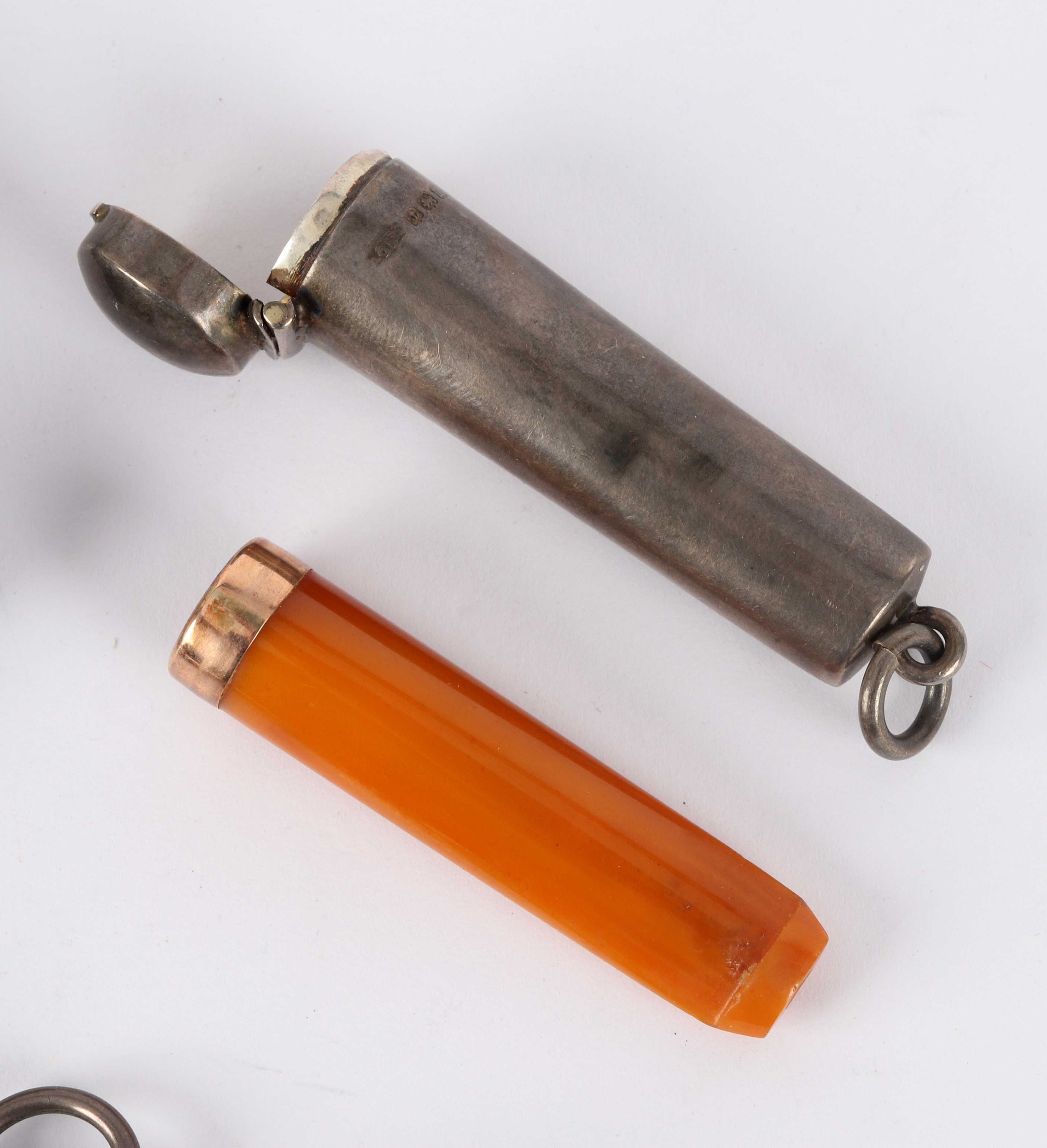 An amber and gold mounted cheroot holder in silver outer case, a silver sovereign holder, - Image 2 of 2
