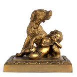 A gilt metal figure of a dog guarding a sleeping child, on a rectangular plinth,