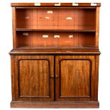 A 19th Century mahogany estate cabinet with bookcase over,